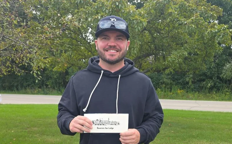 Andrew Grieves holding his Bavarian Inn Lodge prize